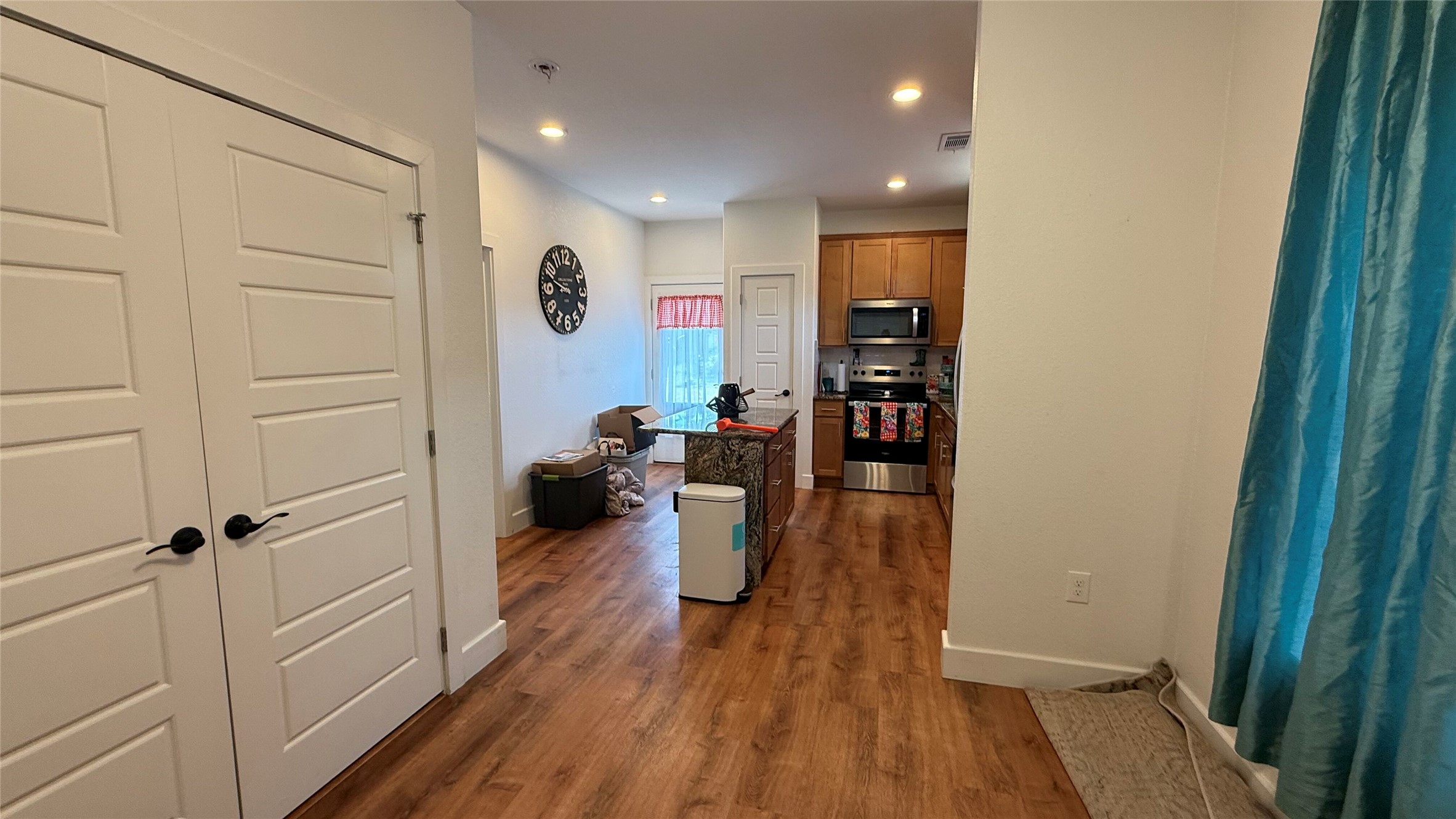 2415 Ridgeview Drive Kingsland, TX 78639 - Photo 4 of 10 Hall featuring dark wood finished floors, baseboards, and recessed lighting