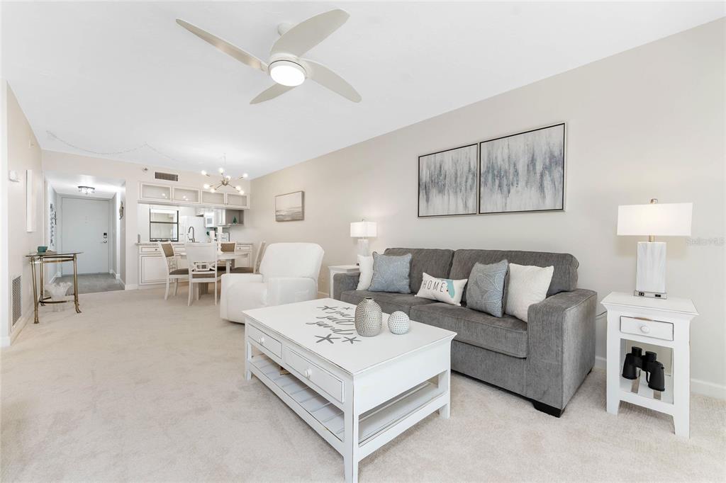 1551 Beach Road, Unit 306 Englewood, FL 34223 - Photo 12 of 50 a living room with furniture and a lamp