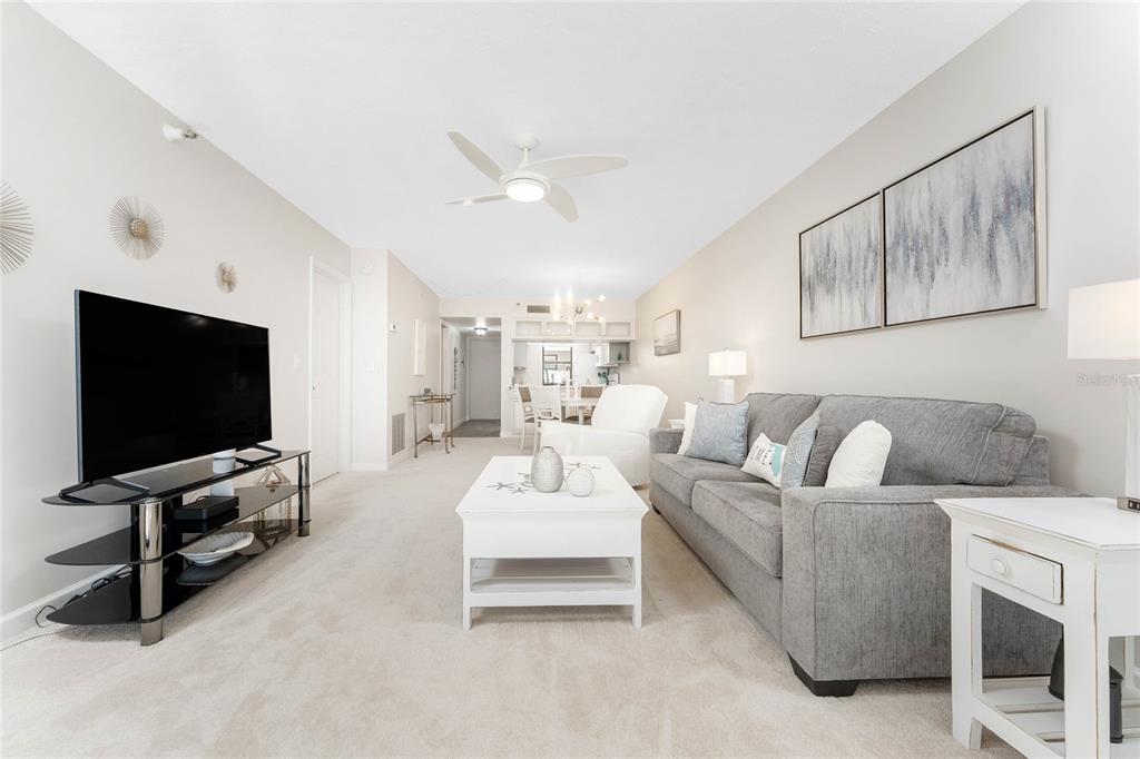 1551 Beach Road, Unit 306 Englewood, FL 34223 - Photo 16 of 50 a living room with furniture and a flat screen tv