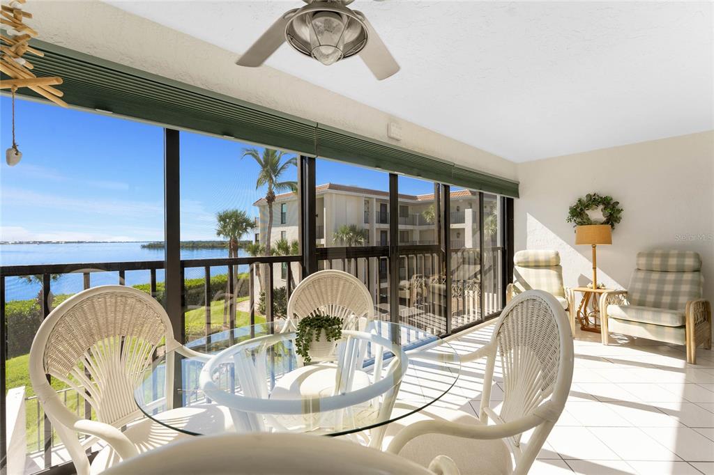 1551 Beach Road, Unit 306 Englewood, FL 34223 - Photo 2 of 50 a view of a dining room with furniture water view and kitchen view
