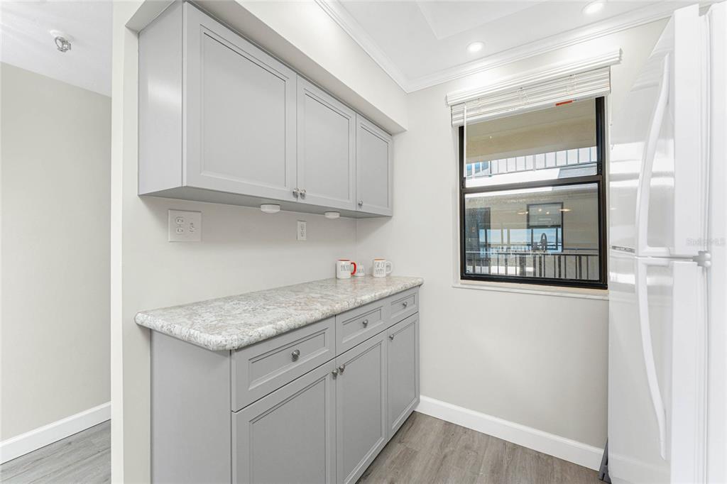1551 Beach Road, Unit 306 Englewood, FL 34223 - Photo 22 of 50 a kitchen with stainless steel appliances granite countertop a sink stove and cabinets