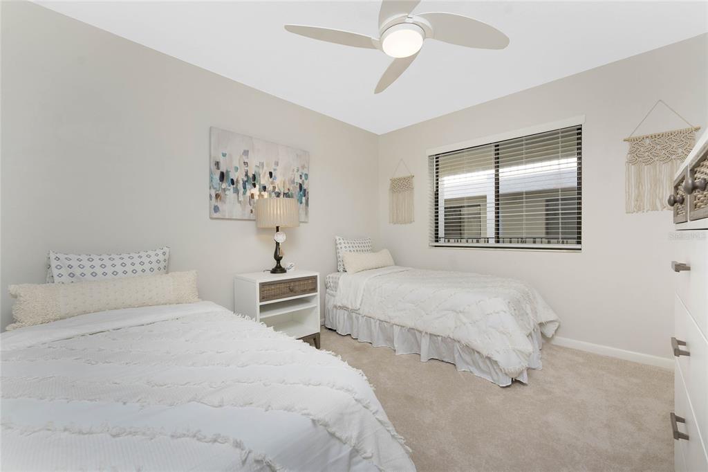 1551 Beach Road, Unit 306 Englewood, FL 34223 - Photo 31 of 50 a bedroom with a bed and a window