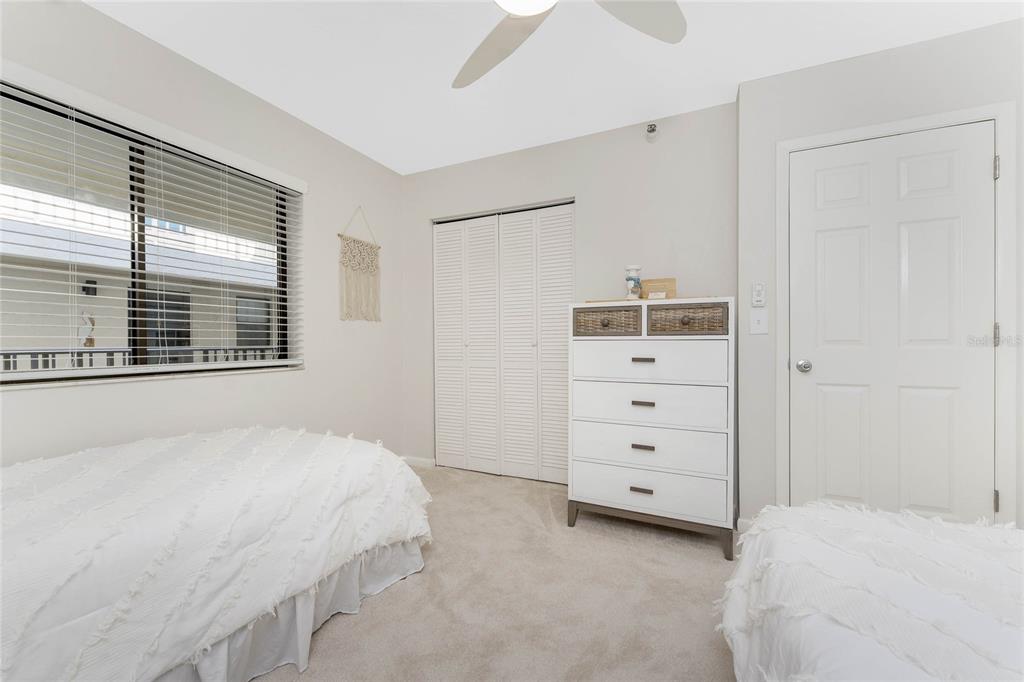 1551 Beach Road, Unit 306 Englewood, FL 34223 - Photo 32 of 50 a bedroom with a bed and a window