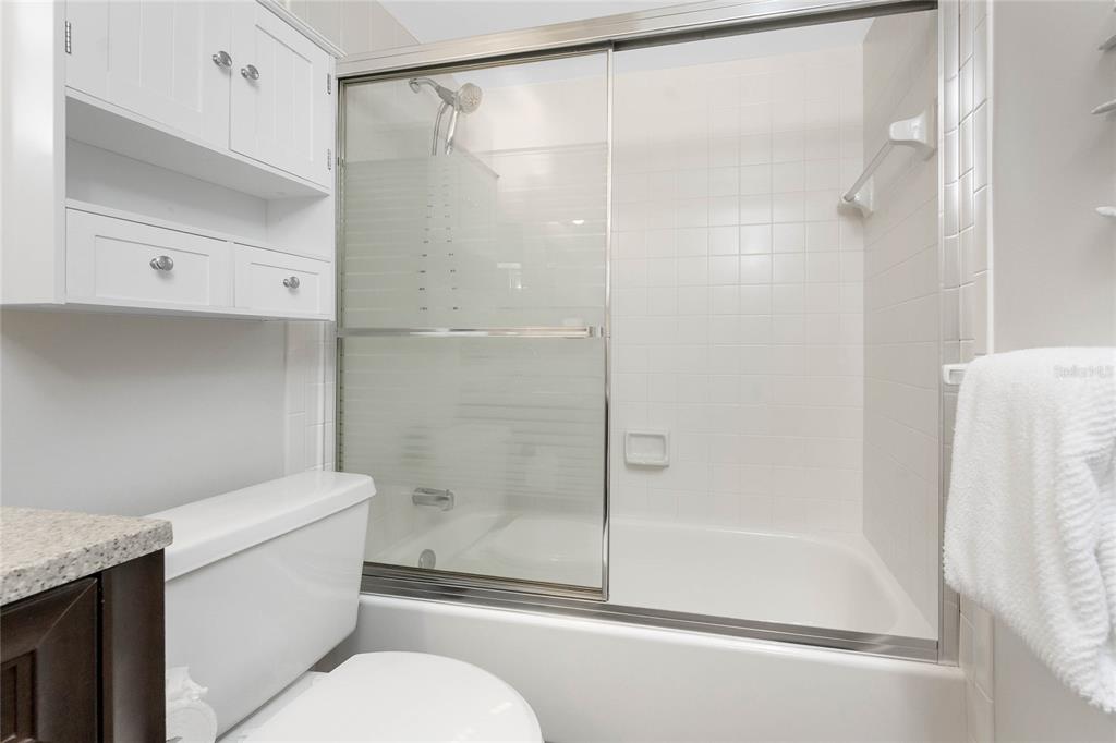 1551 Beach Road, Unit 306 Englewood, FL 34223 - Photo 35 of 50 a bathroom with a shower and a toilet