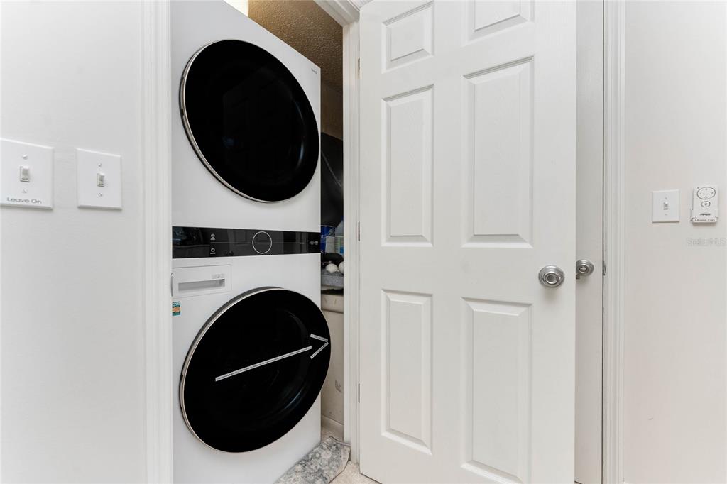1551 Beach Road, Unit 306 Englewood, FL 34223 - Photo 39 of 50 a utility room with dryer and washer
