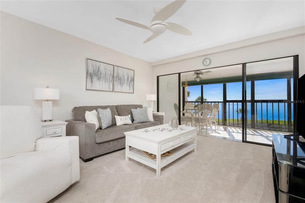 1551 Beach Road, Unit 306 Englewood, FL 34223 - Photo 4 of 50 a spacious bedroom with a large bed and a large window