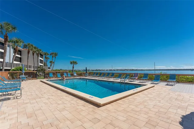 a view of a swimming pool with a lounge chair
