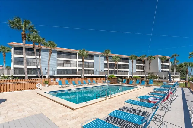 an ocean beach with an outdoor seating