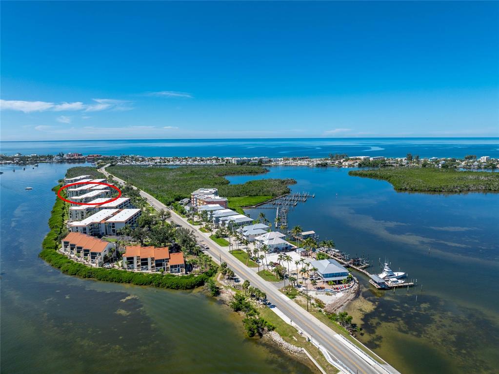 1551 Beach Road, Unit 306 Englewood, FL 34223 - Photo 44 of 50 an aerial view of ocean and residential houses with outdoor space