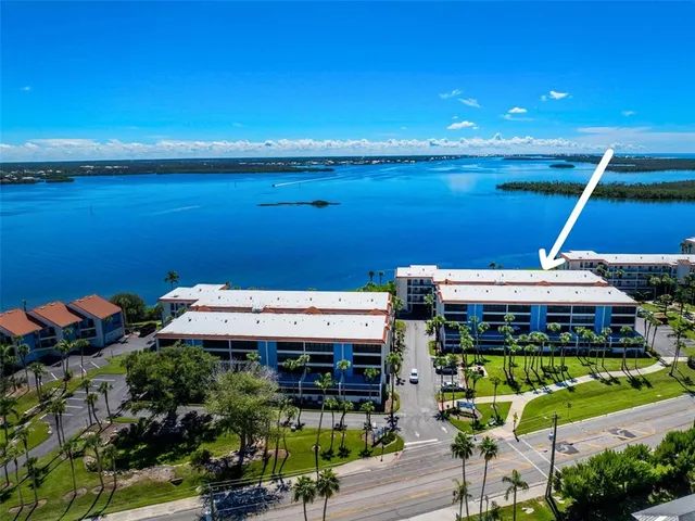 a view of a swimming pool with an outdoor seating and a garden