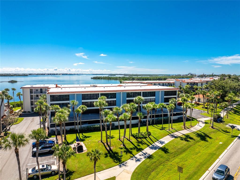1551 Beach Road, Unit 306 Englewood, FL 34223 - Photo 50 of 50 a view of a chairs and table in a patio