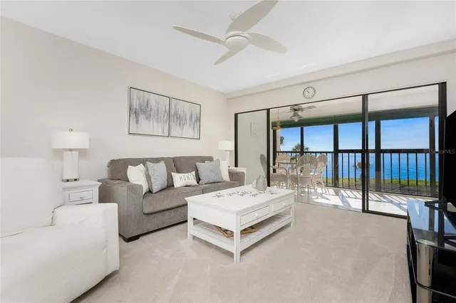 a spacious bedroom with a large bed and a large window