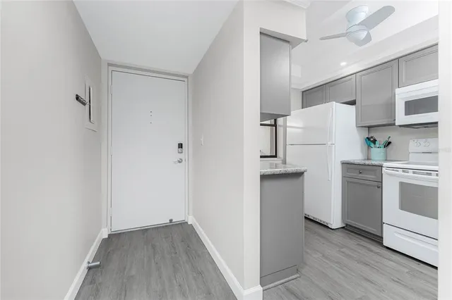 a kitchen with stainless steel appliances a refrigerator and a stove top oven