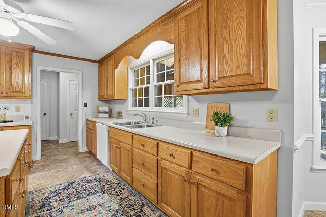 a kitchen that has a lot of cabinets in it