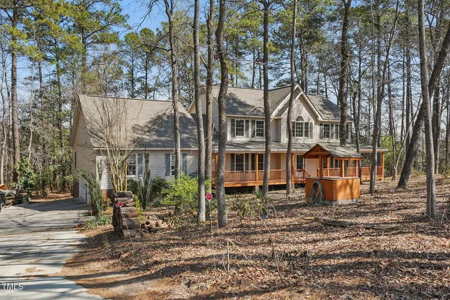 a house that has a tree in front of it