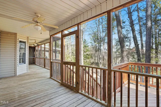 a view of a house with wooden deck