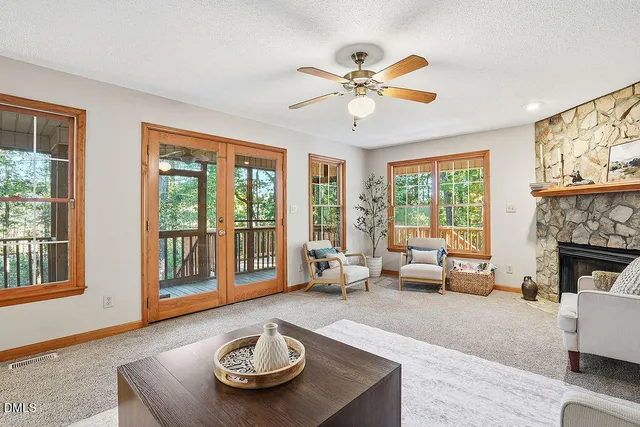 a living room with furniture and a fireplace