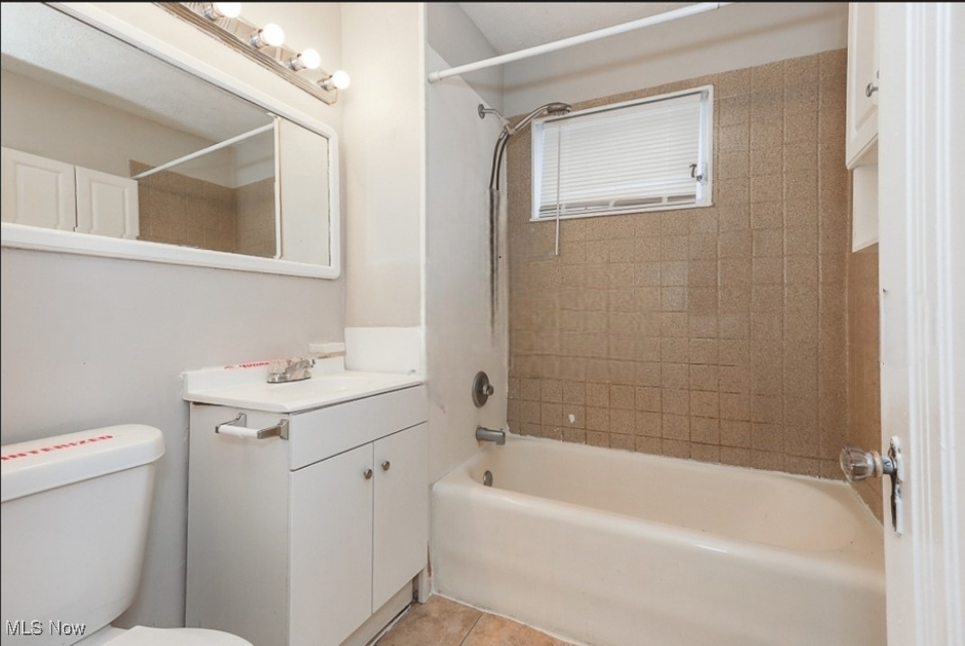 3649 Cummings Road Cleveland, OH 44118 - Photo 8 of 11 Full bathroom with tile patterned flooring, vanity, toilet, and tiled shower / bath