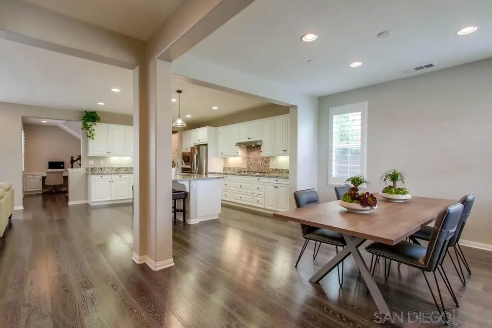 15712 Potomac Ridge Road San Diego, CA 92127 - Photo 3 of 17 a dining room with furniture and wooden floor