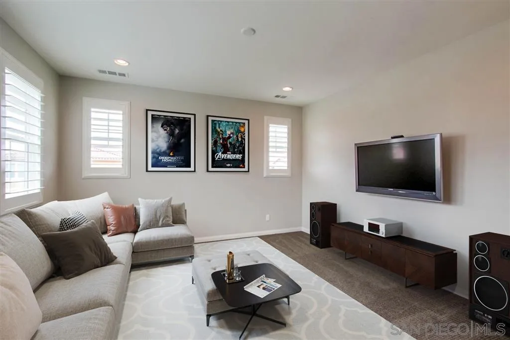 15712 Potomac Ridge Road San Diego, CA 92127 - Photo 8 of 17 a living room with furniture and a flat screen tv