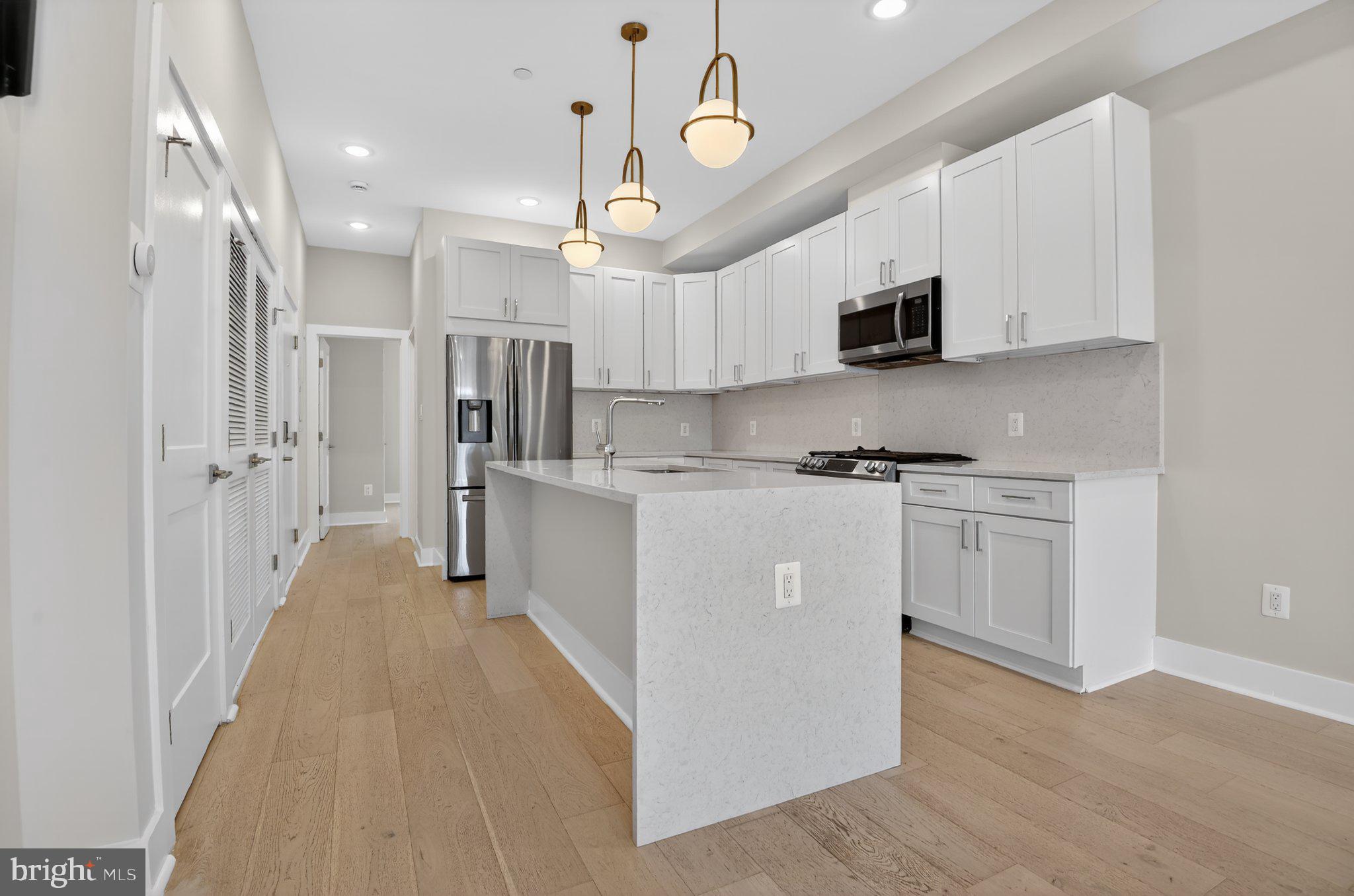 217 20th Street Northeast, Unit 2 Washington, DC 20002 - Photo 5 of 17 Modern kitchen with sleek finishes.