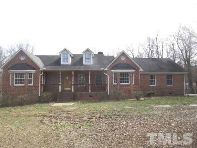 1307 Burlington Road Roxboro, NC 27573 - Photo 1 of 14 a front view of a house with a yard
