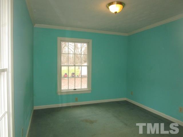 1307 Burlington Road Roxboro, NC 27573 - Photo 11 of 14 a view of an empty room with a window and a fan