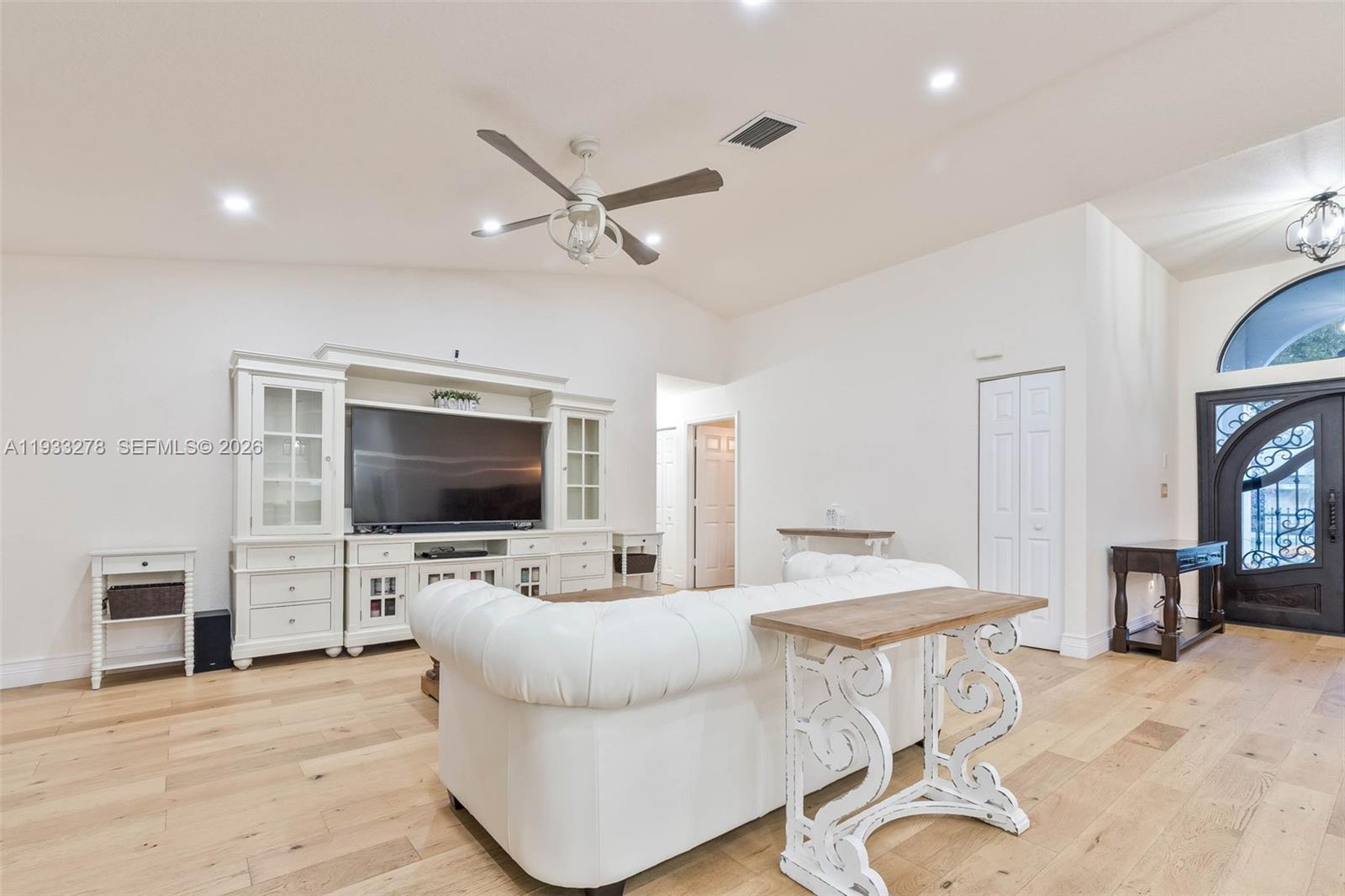 27260 Southwest 167th Court Homestead, FL 33031 - Photo 16 of 44 a living room with furniture and a flat screen tv
