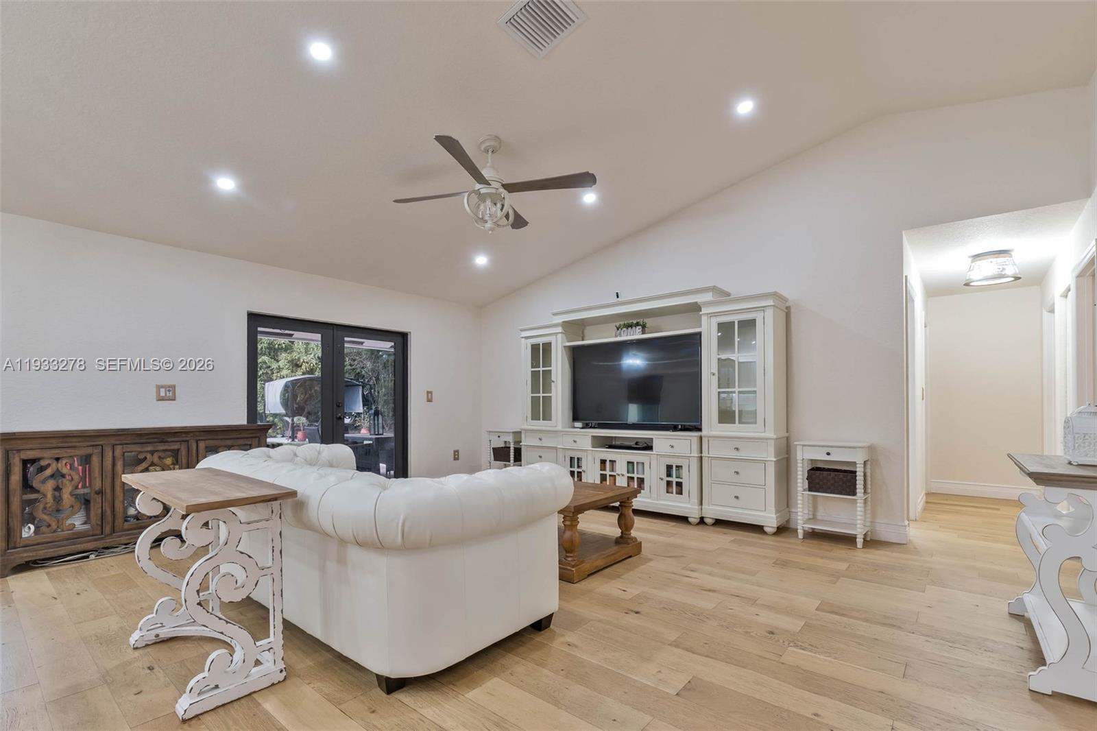 27260 Southwest 167th Court Homestead, FL 33031 - Photo 17 of 44 a living room with furniture and a flat screen tv