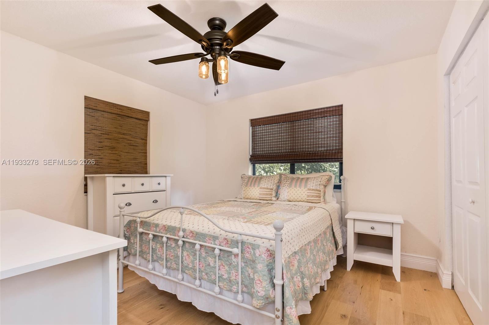 27260 Southwest 167th Court Homestead, FL 33031 - Photo 20 of 44 a bedroom with a bed and a flat screen tv