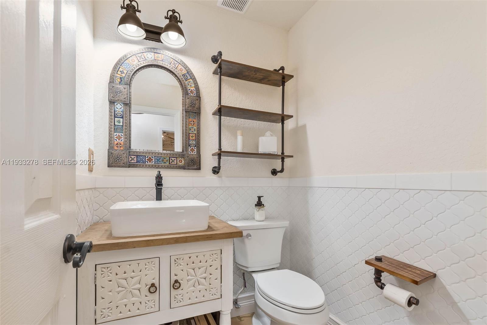 27260 Southwest 167th Court Homestead, FL 33031 - Photo 26 of 44 a bathroom with a sink and a toilet