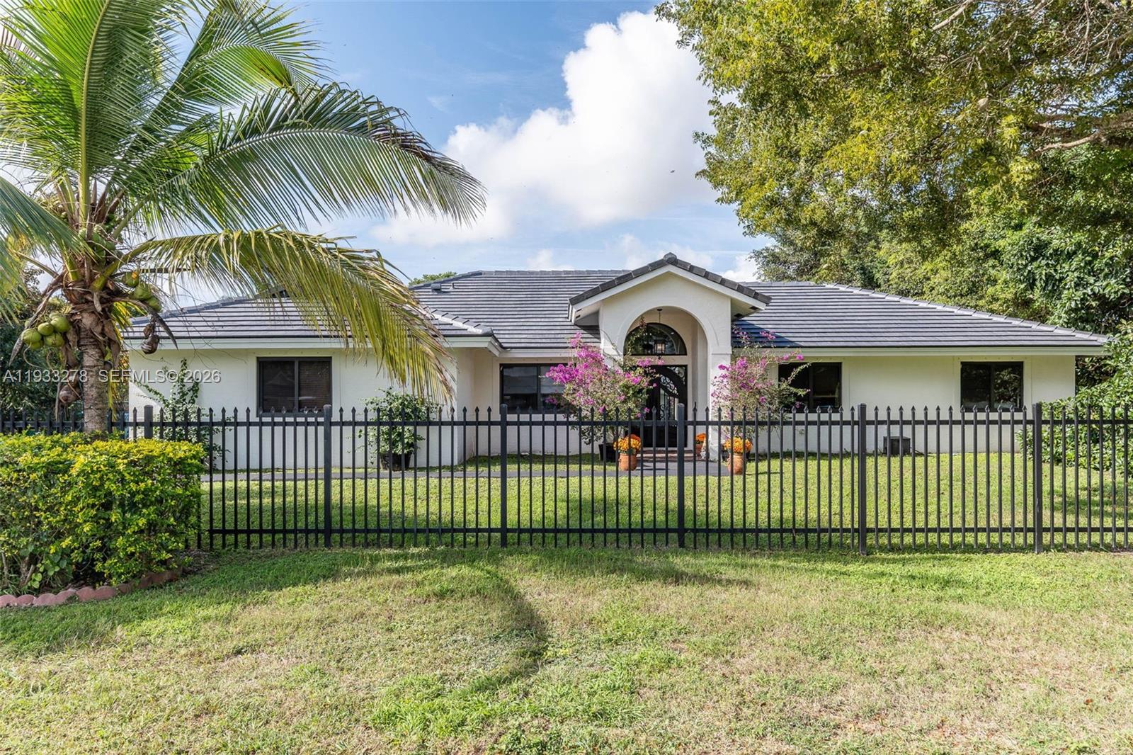 27260 Southwest 167th Court Homestead, FL 33031 - Photo 5 of 44 a view of a house with a garden and plants