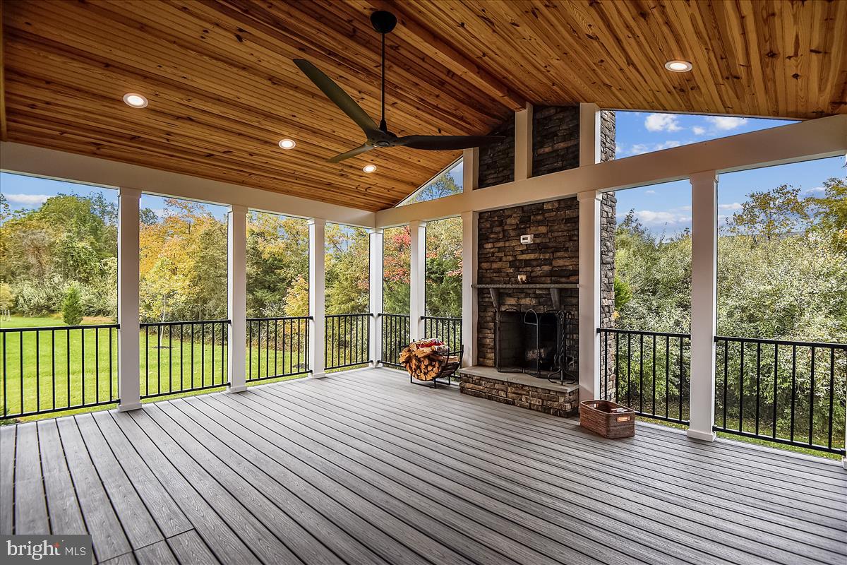 40789 Foxtail Fields Drive Aldie, VA 20105 - Photo 50 of 63 Screened porch with stone fireplace