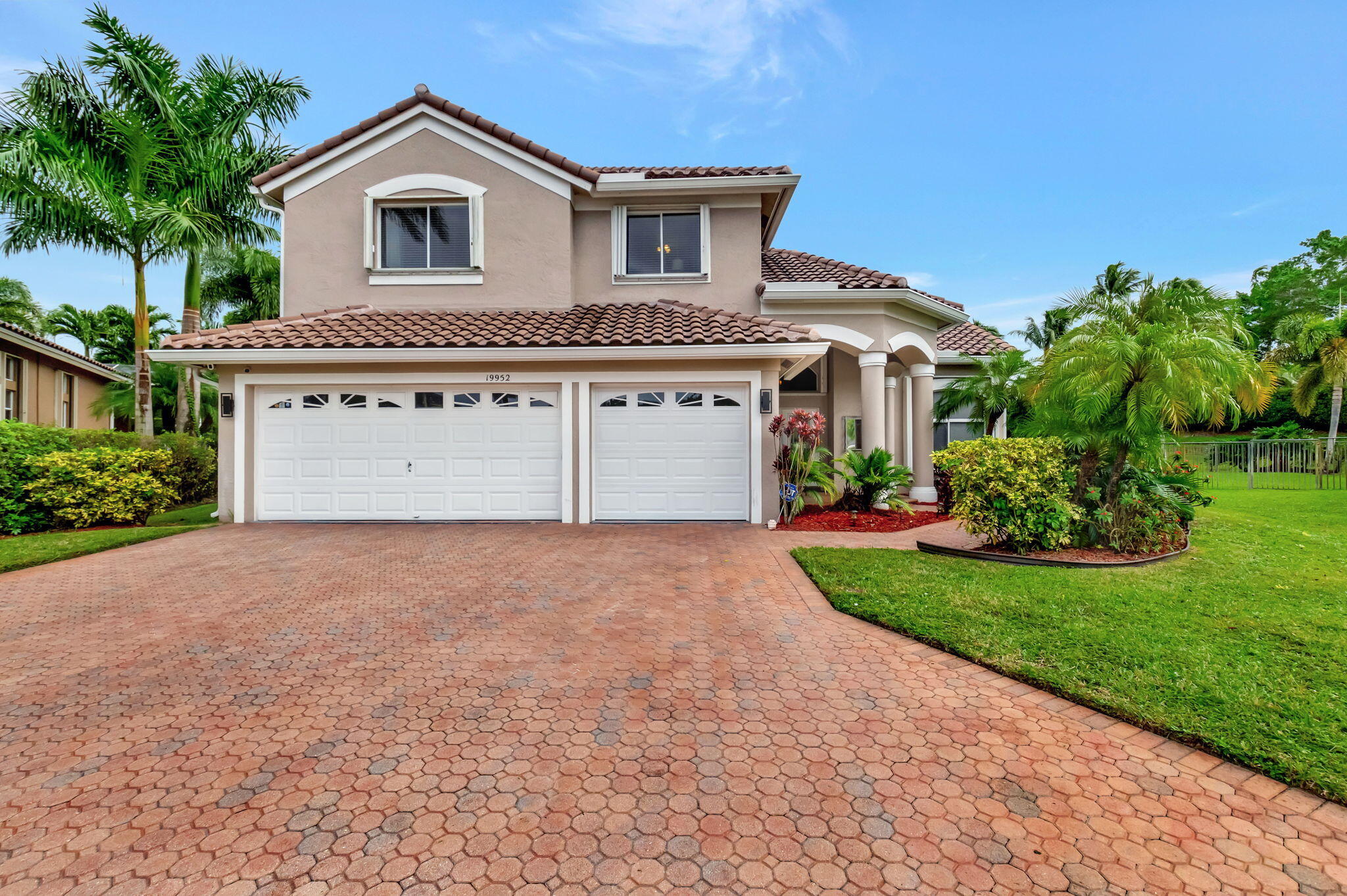19952 Dinner Key Drive Boca Raton, FL 33498 - Photo 1 of 94 a front view of a house with a yard and garage