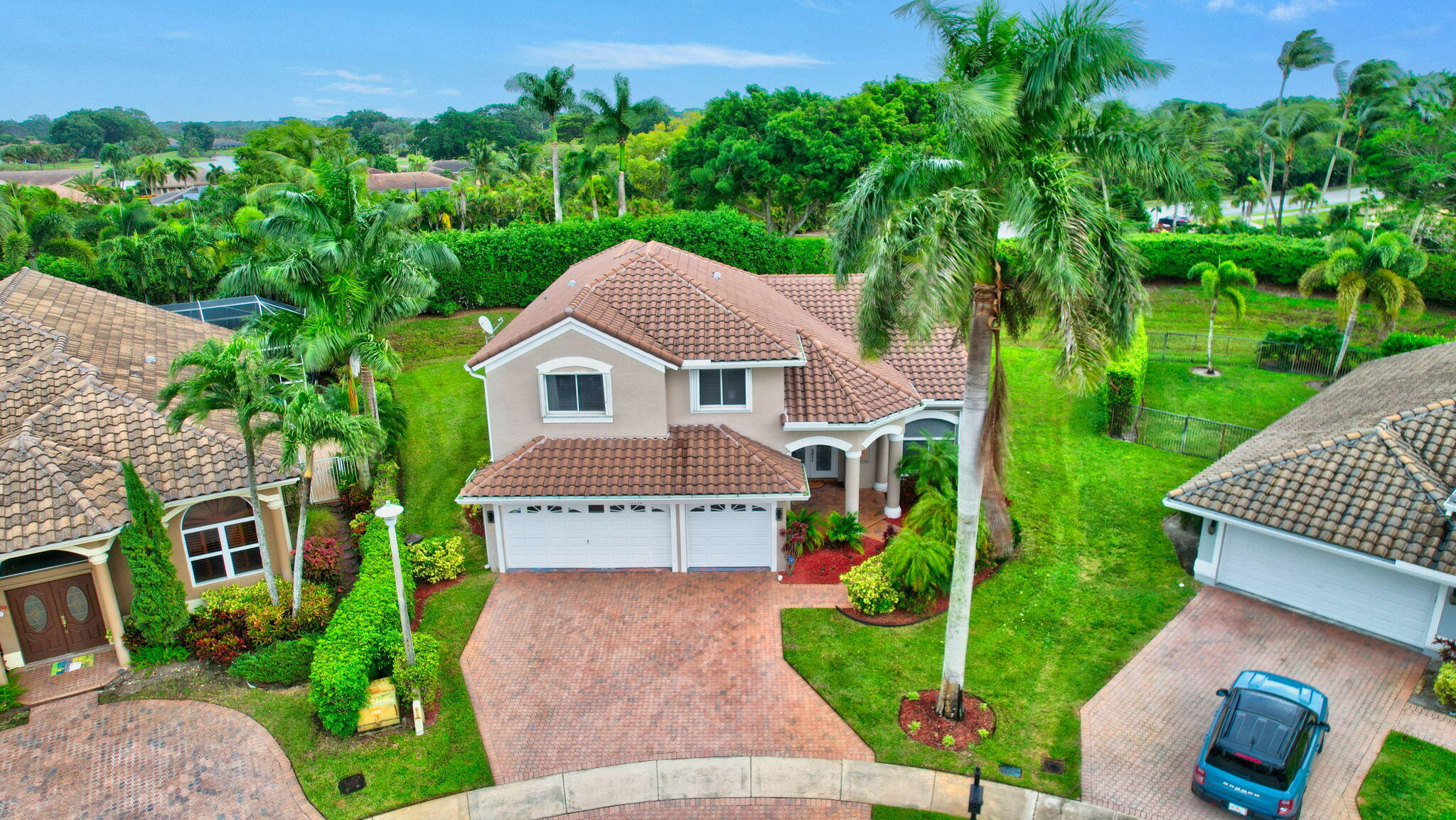 19952 Dinner Key Drive Boca Raton, FL 33498 - Photo 42 of 94 a aerial view of a house with a yard and potted plants