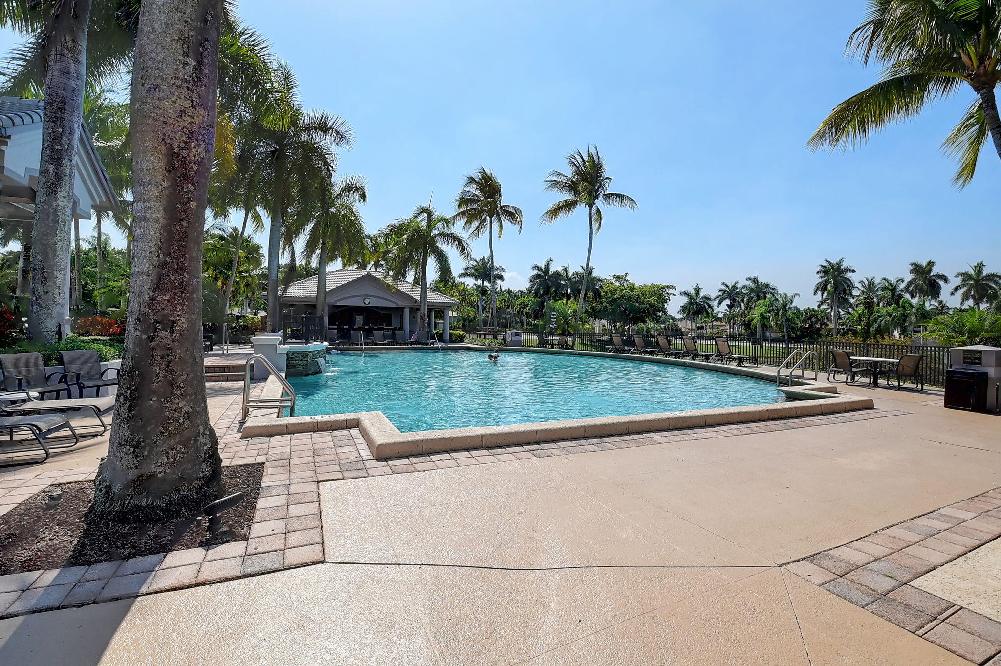 19952 Dinner Key Drive Boca Raton, FL 33498 - Photo 62 of 94 a view of swimming pool with a patio and a garden