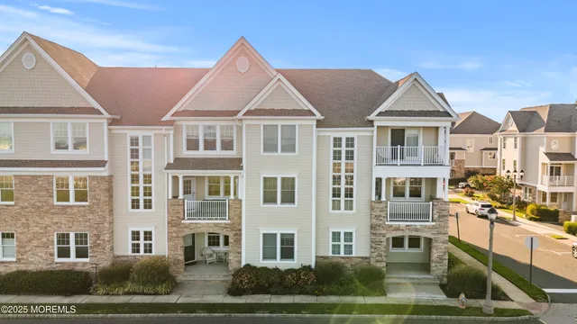 a front view of residential houses with yard
