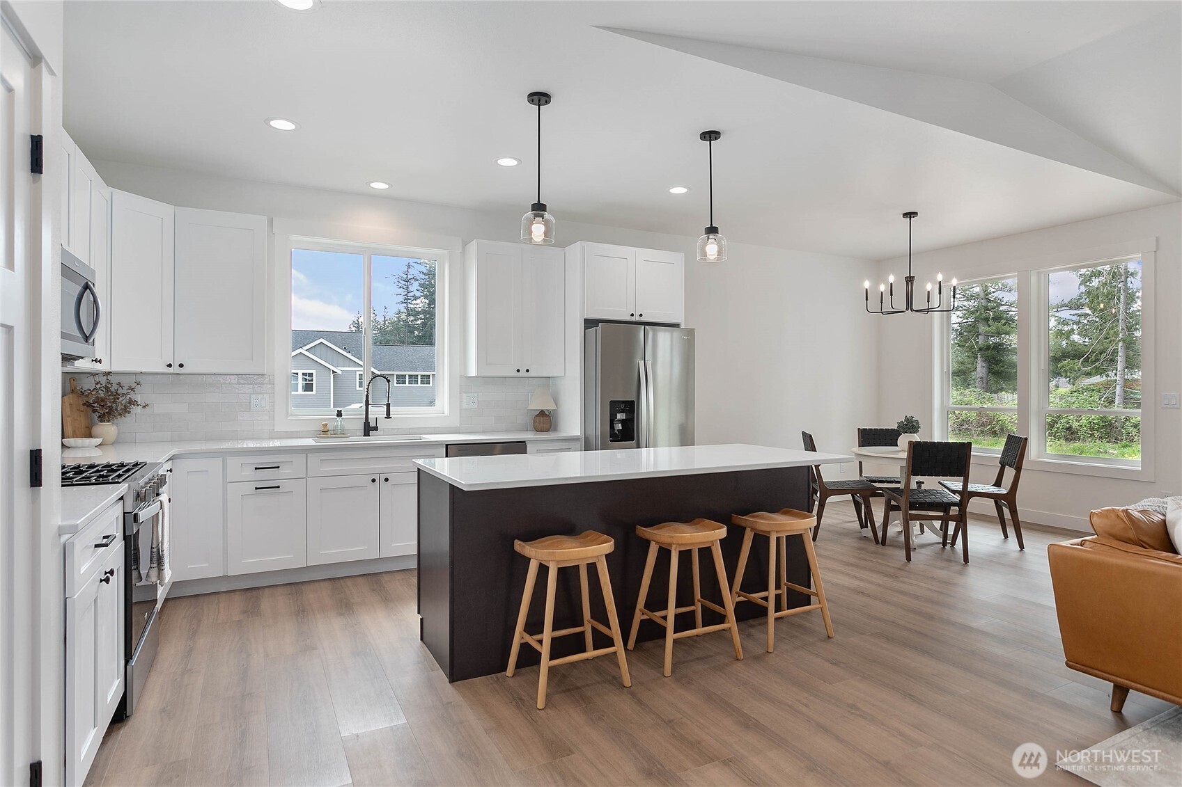 412 West 4th Street Everson, WA 98247 - Photo 11 of 31 a large kitchen with a table and chairs in it