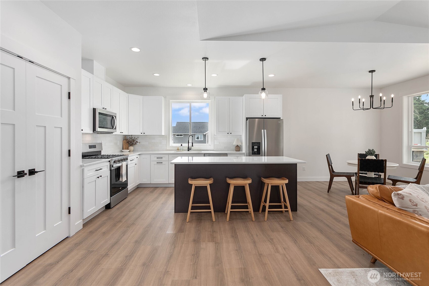 412 West 4th Street Everson, WA 98247 - Photo 13 of 31 a large kitchen with a table and chairs