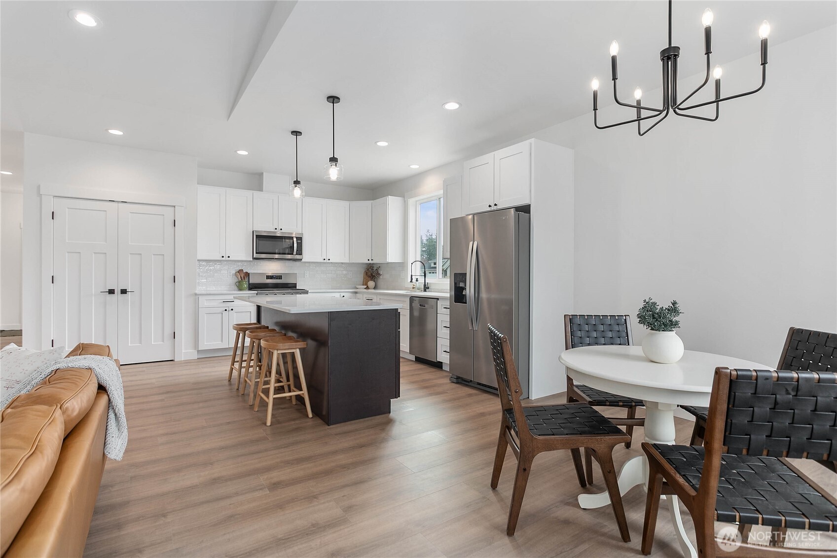 412 West 4th Street Everson, WA 98247 - Photo 18 of 31 a kitchen with kitchen island wooden cabinets and stainless steel appliances