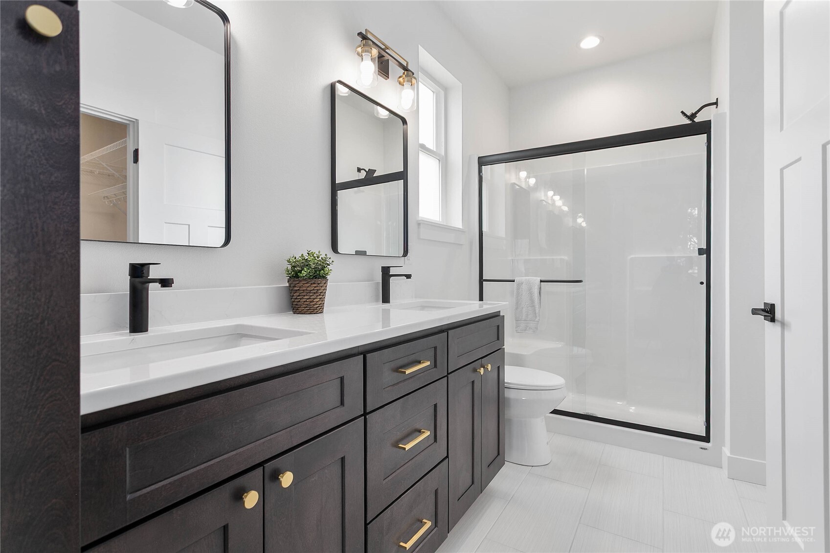 412 West 4th Street Everson, WA 98247 - Photo 29 of 31 a bathroom with a double vanity sink toilet and shower