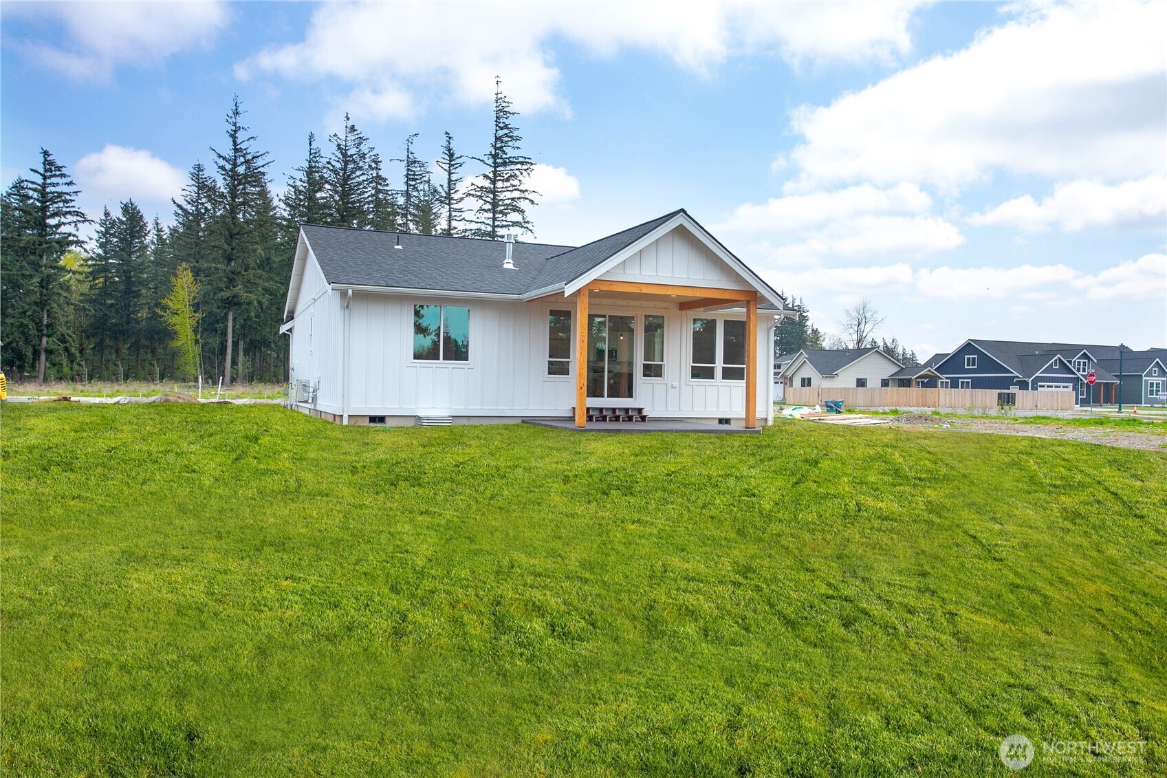412 West 4th Street Everson, WA 98247 - Photo 4 of 31 a front view of house with yard and trees in the background