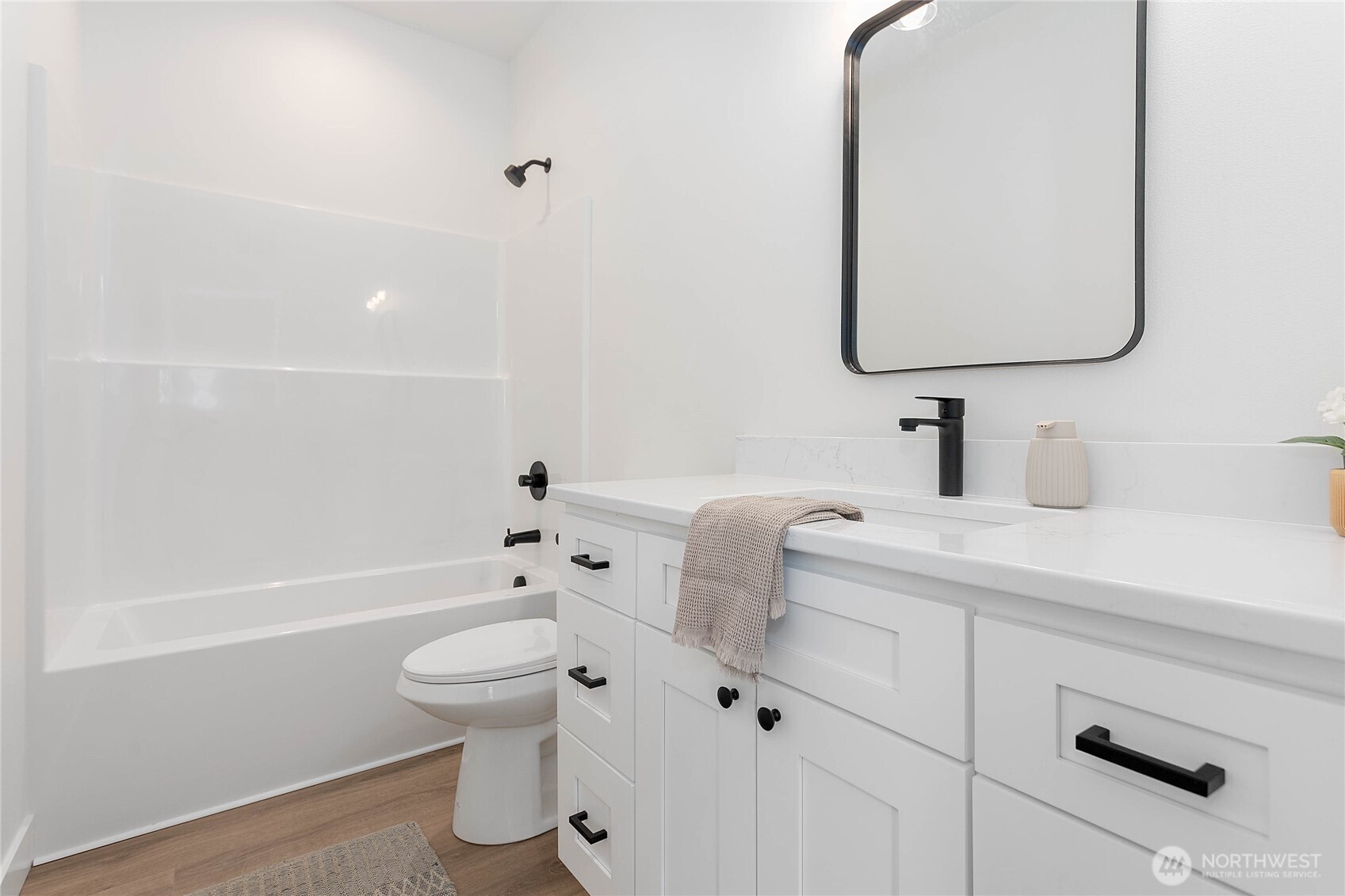 412 West 4th Street Everson, WA 98247 - Photo 6 of 31 a bathroom with a sink a toilet and a mirror