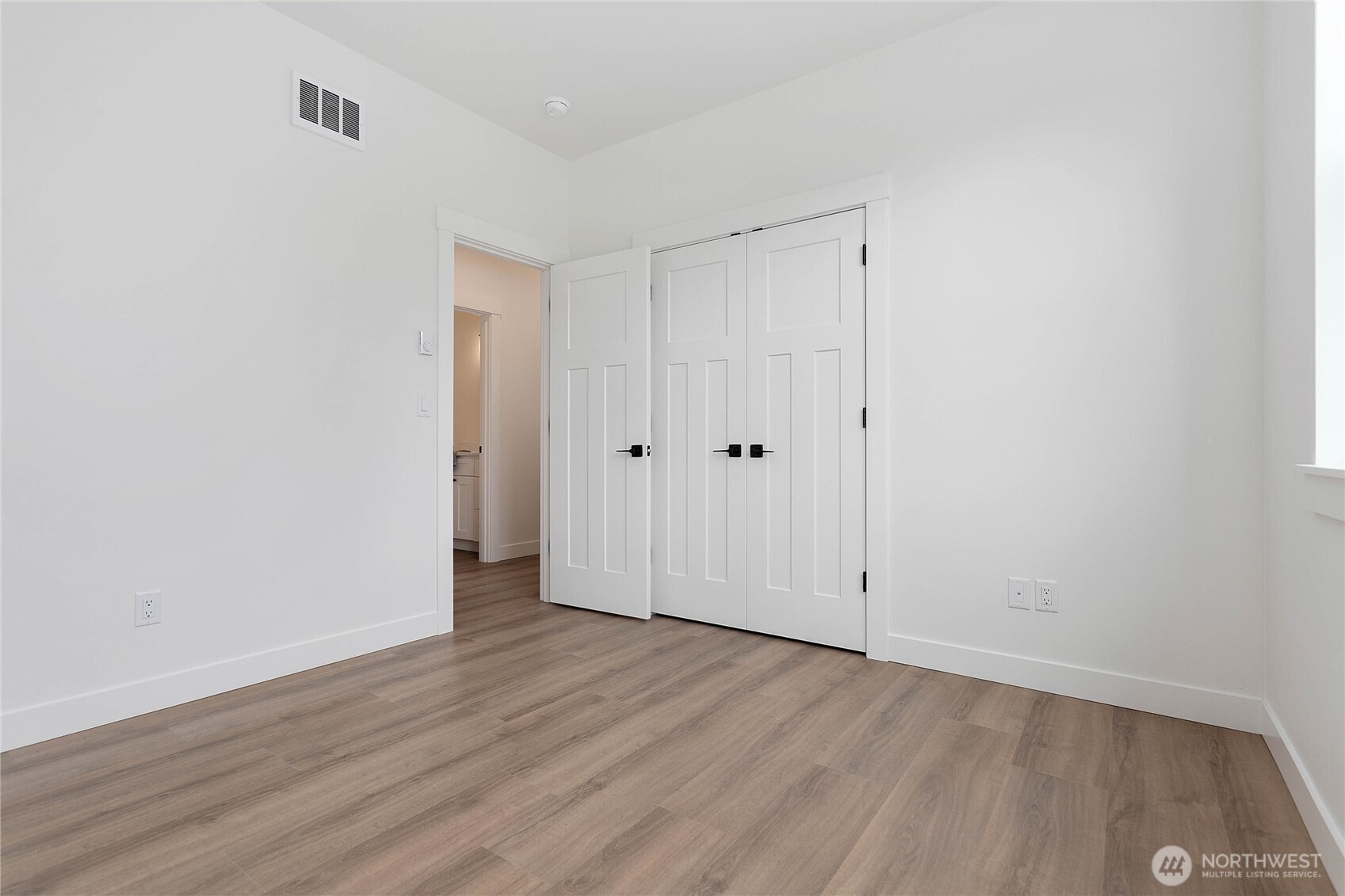 412 West 4th Street Everson, WA 98247 - Photo 10 of 31 a view of an empty room with wooden floor