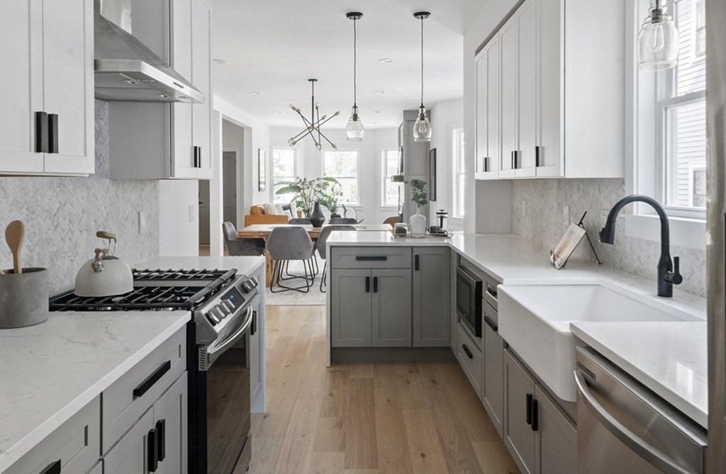 161 Lowell Street, Unit 1 Somerville, MA 02143 - Photo 1 of 18 a kitchen with a sink stove top oven and cabinets