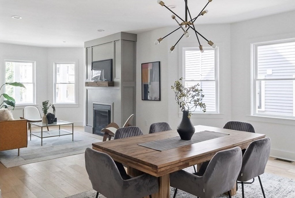 161 Lowell Street, Unit 1 Somerville, MA 02143 - Photo 2 of 18 a view of a dining room with furniture window and wooden floor