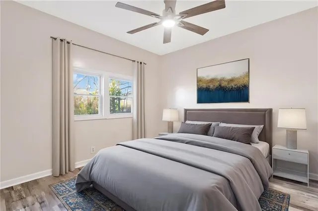 a bedroom with a large bed and a window