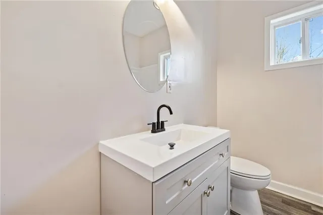 a white bath tub sitting next to a shower