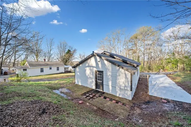 a backyard of a house with lots of green space