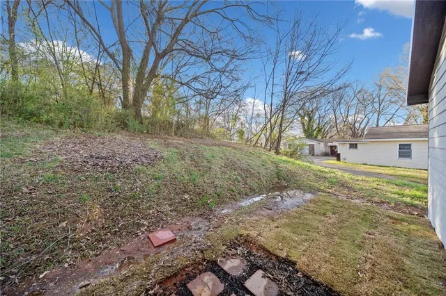 a backyard of a house with lots of green space